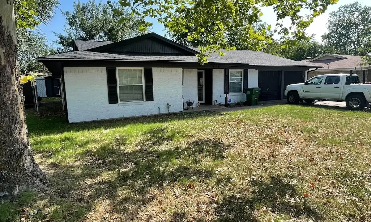 Professional roofing crew working on a residential roof in Seven Corners